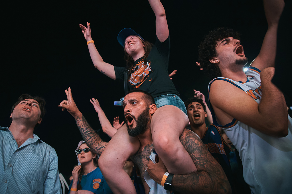 New York Knicks fans celebrate as they watch Game 5 of the NBA Finals basketball series against the San Antonio Spurs, Saturday, June 13, 2026, in New York. (AP Photo/Andres Kudacki)