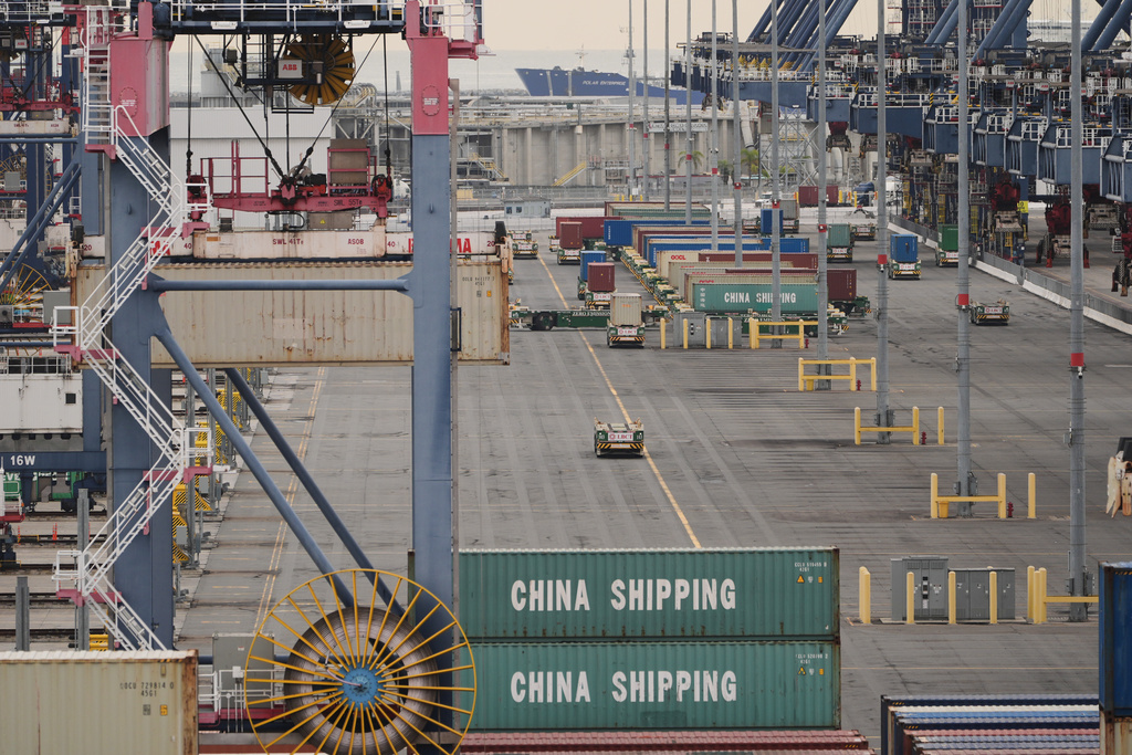 Containers are stacked at the Port of Long Beach Friday, Feb. 20, 2026, in Long Beach, Calif. (AP Photo/Damian Dovarganes)
