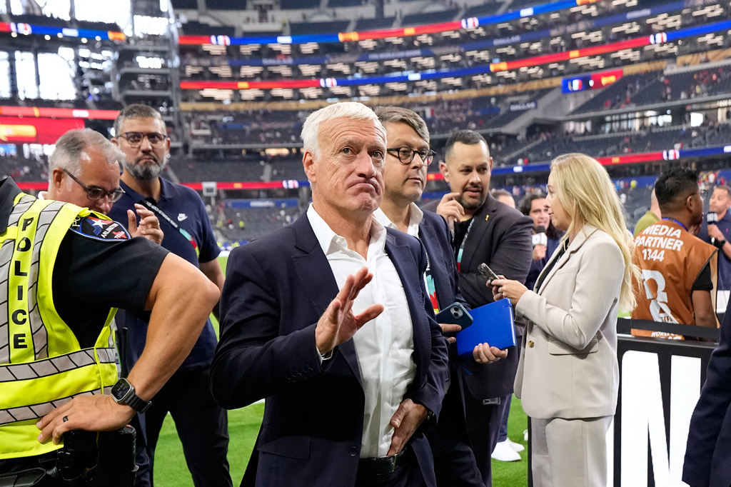 France head coach Didier Deschamps leaves the pitch at the the end of the World Cup semifinal soccer match between France and Spain in Arlington, Texas, near Dallas, Tuesday, July 14, 2026. (AP Photo/Ashley Landis)