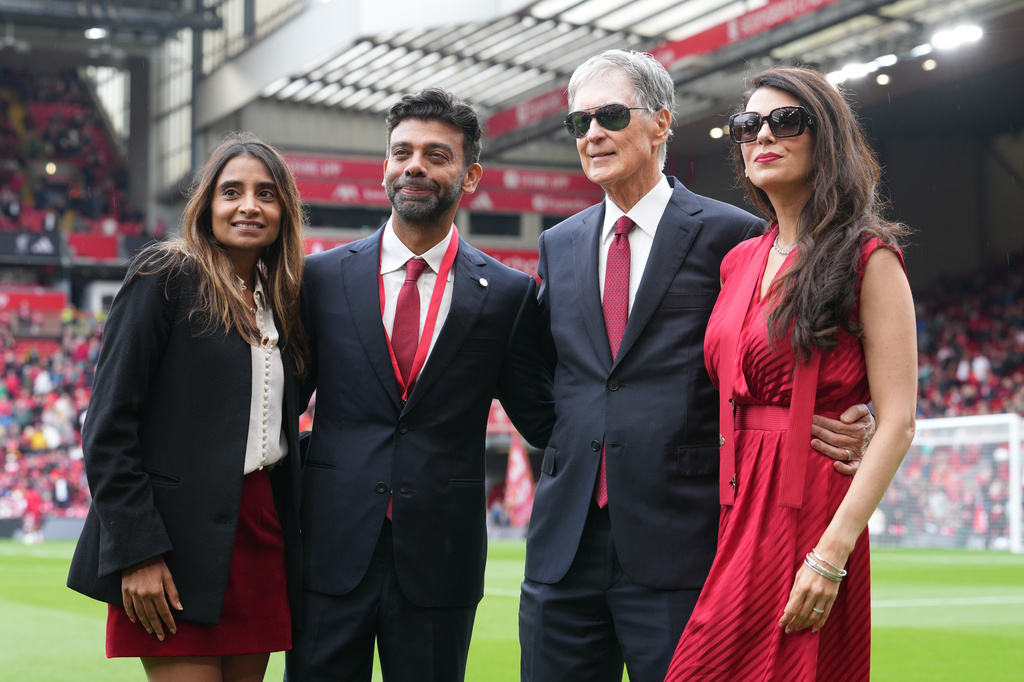 Liverpool's new vice-chairman Amit Bhatia, second left, his wife Vanisha Mittal Bhatia, left, Liverpool owner John Henry and his wife Linda Pizzuti, right, pose ahead the English Premier League soccer match between Liverpool and Nottingham Forest in Liverpool, England, Saturday, Aug. 29, 2026. (AP Photo/Jon Super)