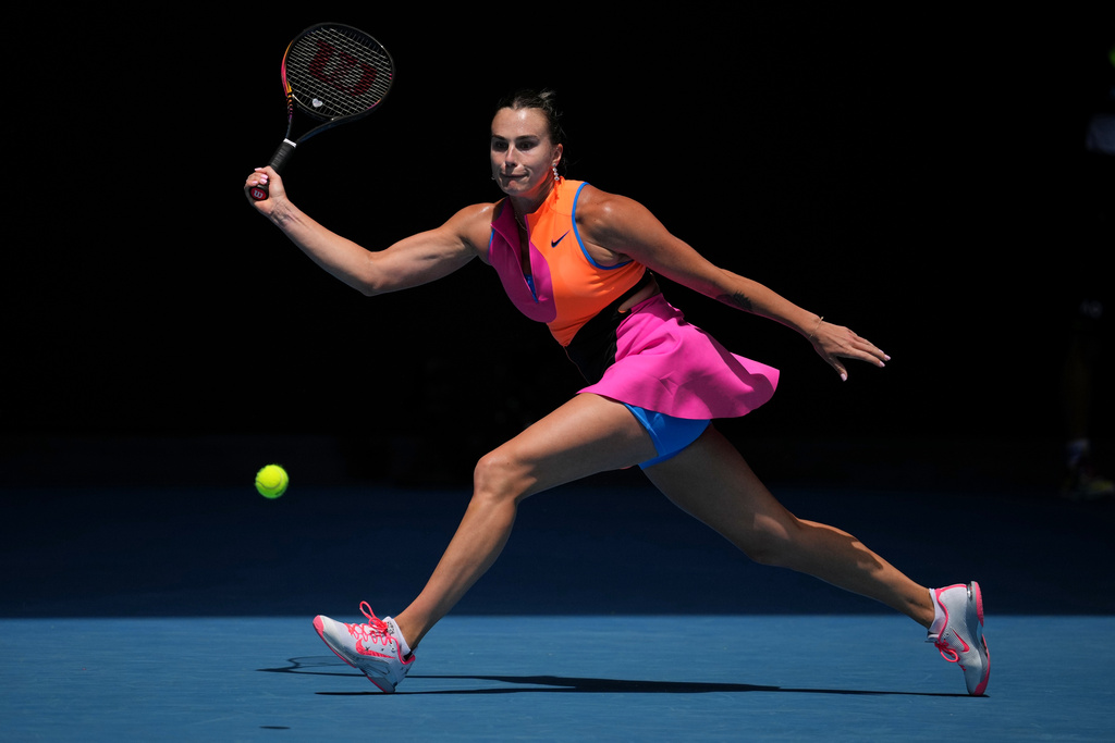Aryna Sabalenka of Belarus plays a forehand return to Victoria Mboko of Canada during their fourth round match at the Australian Open tennis championship in Melbourne, Australia, Sunday, Jan. 25, 2026. (AP Photo/Dita Alangkara)