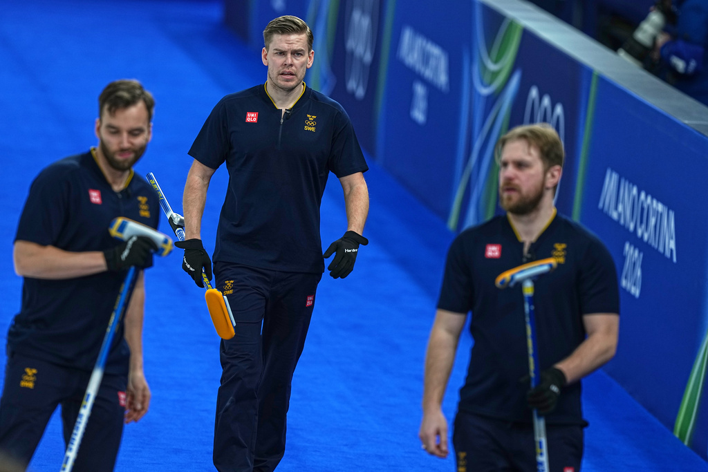 Sweden's Rasmus Wranaa, Oskar Eriksson and Christoffer Sundgren compete during the men's curling round robin session against Czechia at the 2026 Winter Olympics, in Cortina d'Ampezzo, Italy, Thursday, Feb. 19, 2026. (AP Photo/Fatima Shbair)