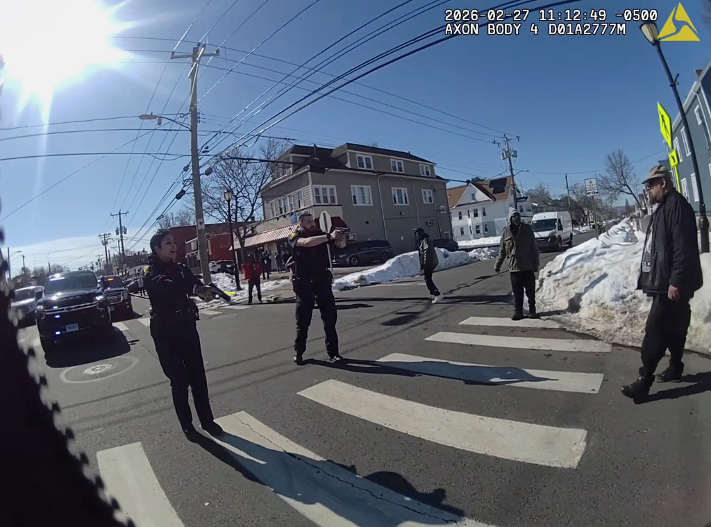 This photo taken from Hartford Police body camera video shows Steven Jones, right, as police officers shout commands to him seconds before he is shot by officer Joseph Magnano, center, Friday, Feb. 27, 2026 in Hartford, Conn. (Hartford Police Department via AP)