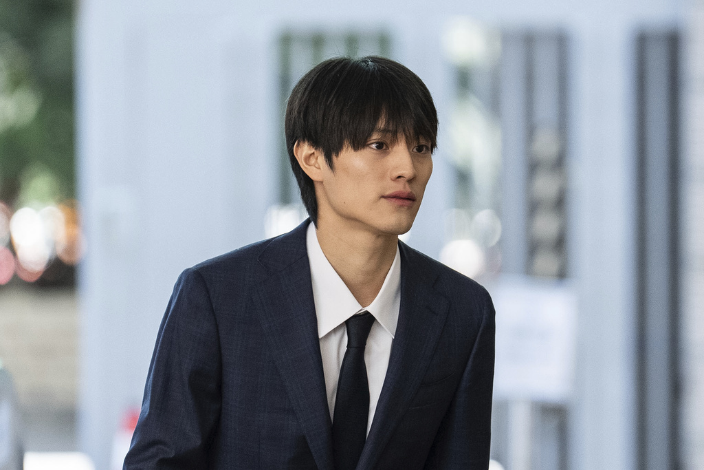 J-pop star Kenshin Kamimura arrives at the West Kowloon Magistrates' Courts to hear verdict over his indecent assault case in Hong Kong, Wednesday, August 13, 2025. (AP Photo/Chan Long Hei)
