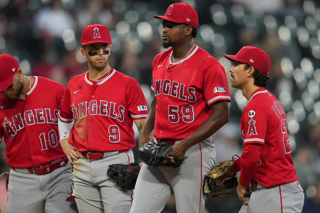 Los Angeles Angels starting pitcher José Soriano (59) gets a mound visit during the third inning of a baseball game against the Chicago White Sox, Tuesday, April 28, 2026, in Chicago. (AP Photo/Erin Hooley)