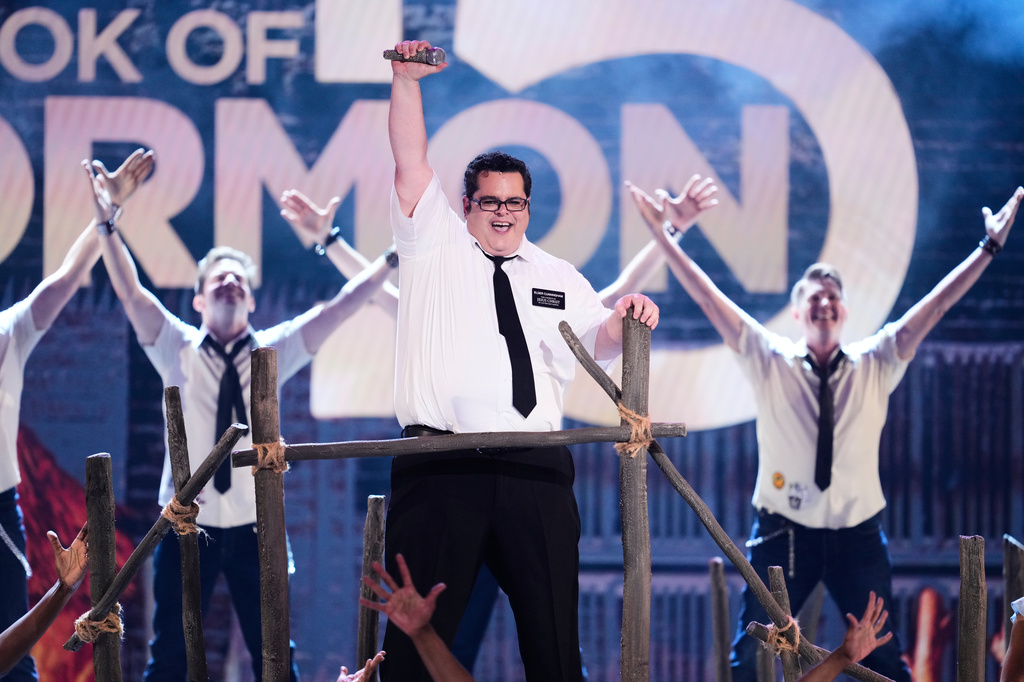 Josh Gad, center, performs a number from "The Book of Mormon" during the 79th Tony Awards on Sunday, June 7, 2026, at Radio City Music Hall in New York. (Photo by Charles Sykes/Invision/AP)