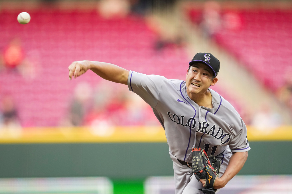 Colorado Rockies pitcher Tomoyuki Sugano throws during the second inning of a baseball game against the Cincinnati Reds, Wednesday, April 29, 2026, in Cincinnati. (AP Photo/Jeff Dean)