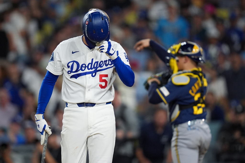 Los Angeles Dodgers first baseman Freddie Freeman walks to the dugout after striking out during the fifth inning of Game 4 of baseball's National League Championship Series between the Milwaukee Brewers and the Los Angeles Dodgers, Thursday, Oct. 15, 2026, in Los Angeles. (AP Photo/Gregory Bull)