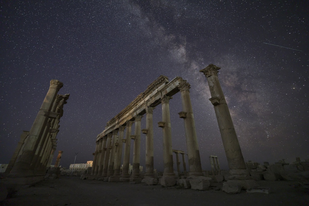 The ruins of the ancient city of Palmyra under a star-studded sky in Syria, in the late hours of Tuesday, Aug. 26, 2025.(AP Photo/Ghaith Alsayed)