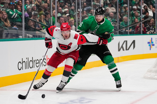 Carolina Hurricanes' Jordan Martinook (48) and Dallas Stars' Lian Bichsel compete in the second period of an NHL hockey game Saturday, Oct. 25, 2025, in Dallas. (AP Photo/Tony Gutierrez) Carolina Hurricanes' Jordan Martinook (48) and Dallas Stars' Lian Bichsel compete in the second period of an NHL hockey game Saturday, Oct. 25, 2025, in Dallas. (AP Photo/Tony Gutierrez)