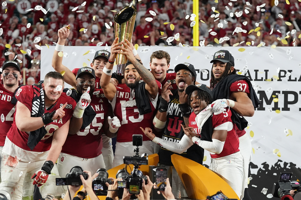 Indiana holds the trophy after their win against Miami in the College Football Playoff national championship game, Monday, Jan. 19, 2026, in Miami Gardens, Fla. (AP Photo/Lynne Sladky)