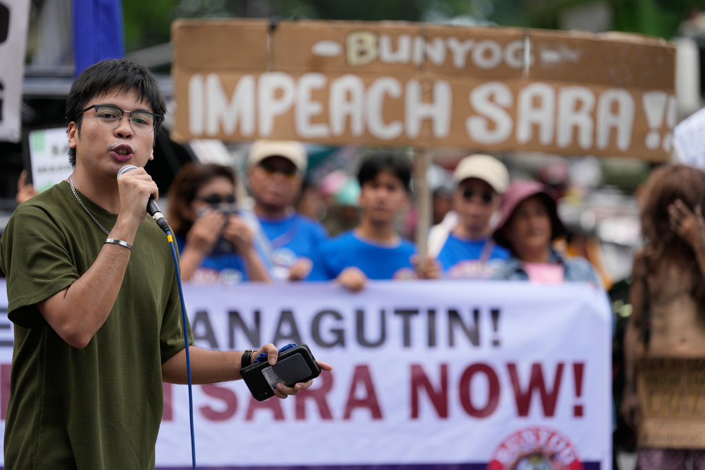 Protesters hold slogans during a rally outside the House of Representatives while a congressional hearing on an impeachment bid against Vice President Sara Duterte is ongoing in Quezon, Philippines, Wednesday, April 29, 2026. (AP Photo/Aaron Favila)