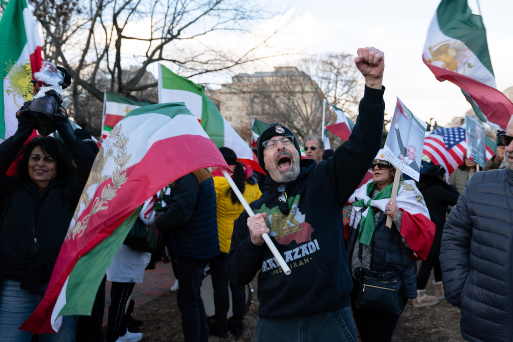 Activists take part in a rally supporting protesters in Iran at Lafayette Park, across from the White House in Washington, Sunday, Jan. 11, 2026. (AP Photo/Jose Luis Magana)