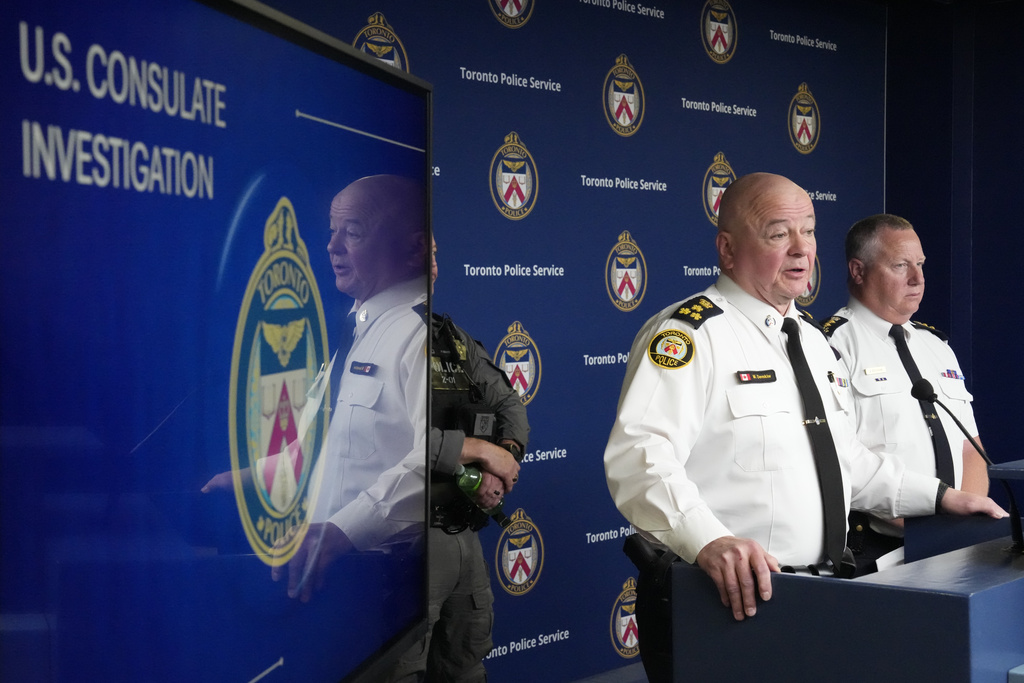 Toronto Police Chief Myron Demkiw speaks at a news conference in Toronto as RCMP Chief Supt. Jamie Zettler, right, looks on, on Tuesday, June 16, 2026. (Frank Gunn/The Canadian Press via AP)