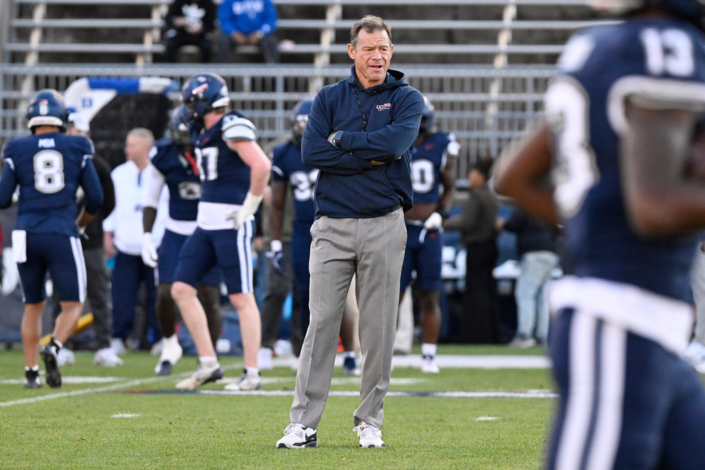 UConn head coach Jim Mora watches his team warm up before an NCAA college football game against Duke, Saturday, Nov. 8, 2025, in East Hartford, Conn. (AP Photo/Jessica Hill)