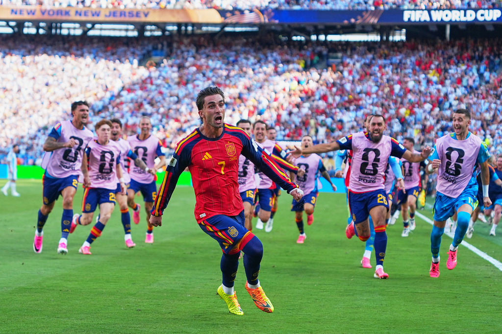 Spain's Ferran Torres (7) celebrates scoring their first goal during the World Cup final soccer match between Spain and Argentina in East Rutherford, N.J., near New York, Sunday, July 19, 2026. (AP Photo/Julio Cortez)