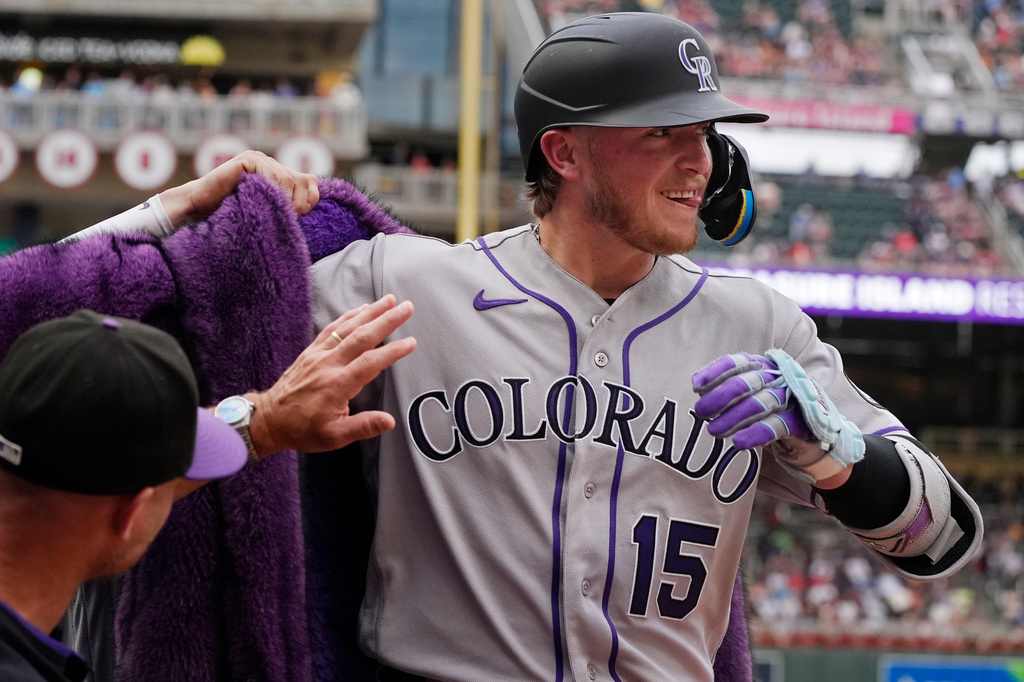 Colorado Rockies' Hunter Goodman celebrates his solo home run against the Minnesota Twins in the third inning of a baseball game Saturday, June 27, 2026, in Minneapolis. (AP Photo/Bruce Kluckhohn)