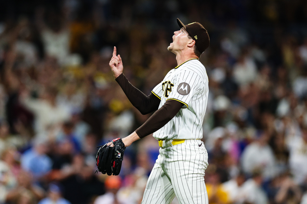 San Diego Padres' Mason Miller reacts after the team defeated the Toronto Blue Jays in a baseball game Saturday, July 11, 2026, in San Diego. (AP Photo/Derrick Tuskan)
