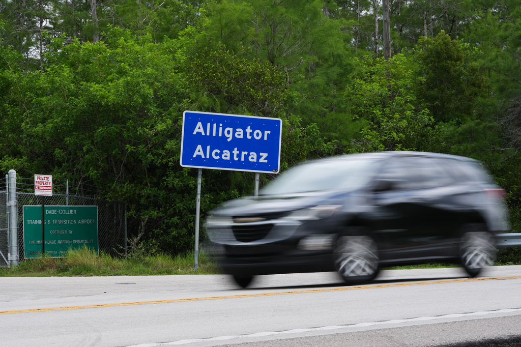 A car drives near the entrance to the "Alligator Alcatraz" detention center Monday, May 11, 2026, in Ochopee, Fla. (AP Photo/Marta Lavandier)