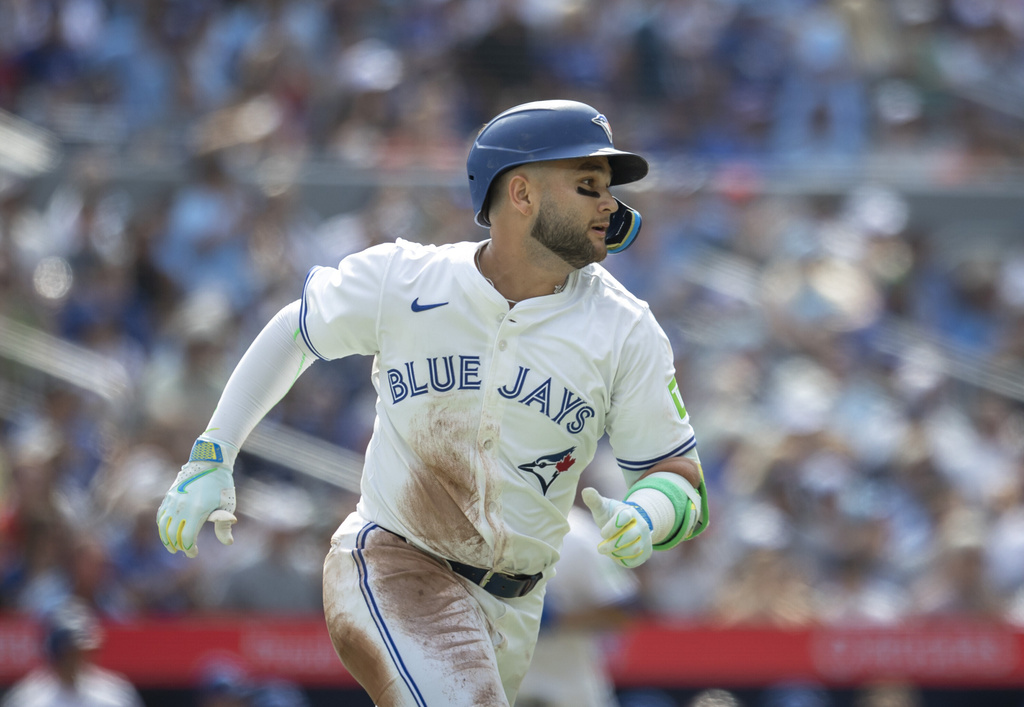 Toronto Blue Jays' Bo Bichette (11) doubles against the Texas Rangers during the second inning of a baseball game in Toronto, Saturday, Aug. 16, 2025. (Tara Walton/The Canadian Press via AP)