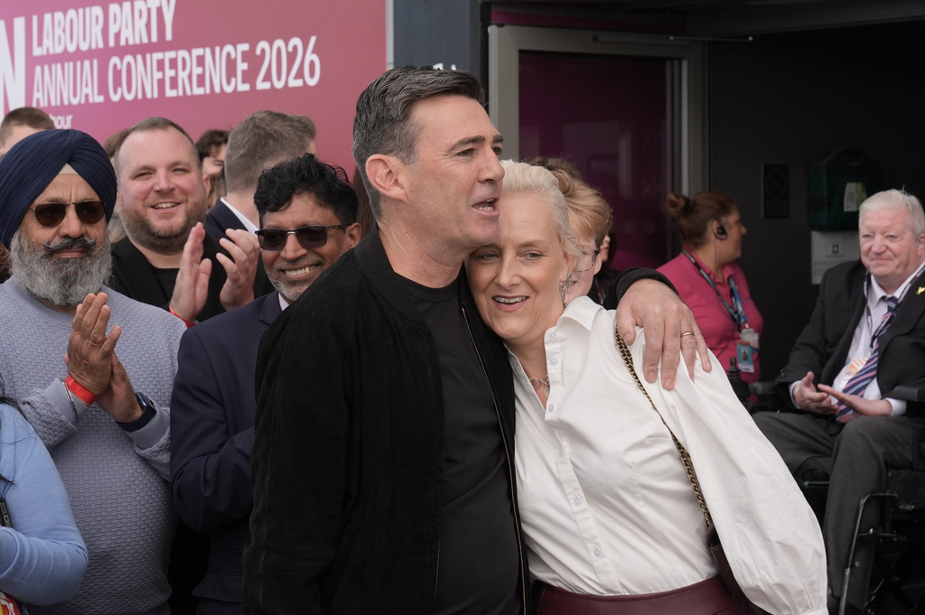 Britain's Prime Minister Andy Burnham and his wife Marie-France Van Heel arrive for the Labour Party Conference at the ACC Liverpool, in Liverpool, England, Saturday, Sept. 26, 2026. (Stefan Rousseau/PA via AP)