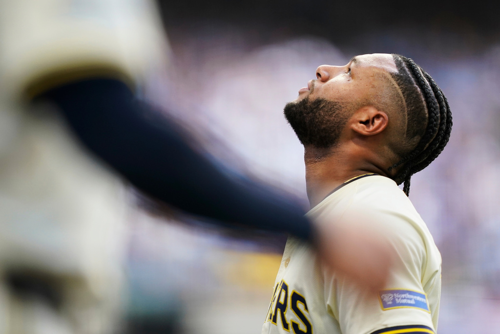 Milwaukee Brewers' Jackson Chourio (11) reacts to leaving the game with an injury during the second inning in Game 1 of baseball's National League Division Series game against the Chicago Cubs on Saturday, Oct. 4, 2025, in Milwaukee. (AP Photo/Kayla Wolf)