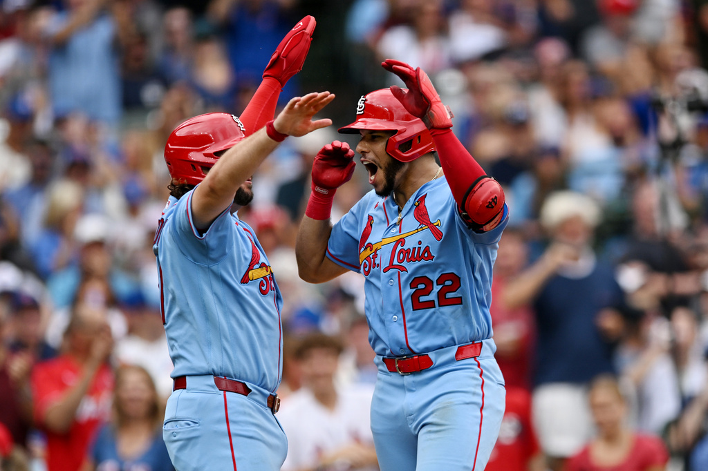 St. Louis Cardinals' Joshua Baez (22) celebrates with teammate Alec Burleson, left, after hitting a two-run home run during the sixth inning of a baseball game against the Chicago Cubs in Chicago, Saturday, Aug. 15, 2026. (AP Photo/Paul Beaty)