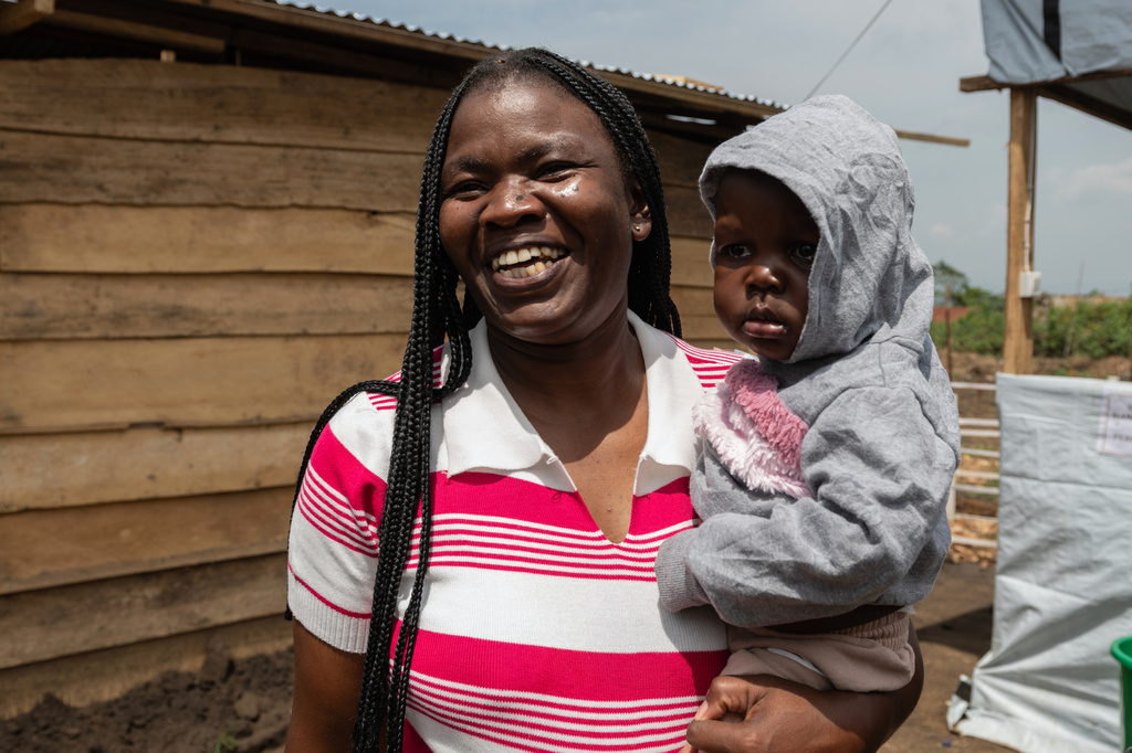 Kahindo Mireille Pierrette, an Ebola survivor poses with her 16-month old baby, after they were declared to have survived Ebola and discharged from the Rwampara treament Center in Ituri Congo, Tuesday, June 16, 2026. (AP Photo/Moses Sawasawa)