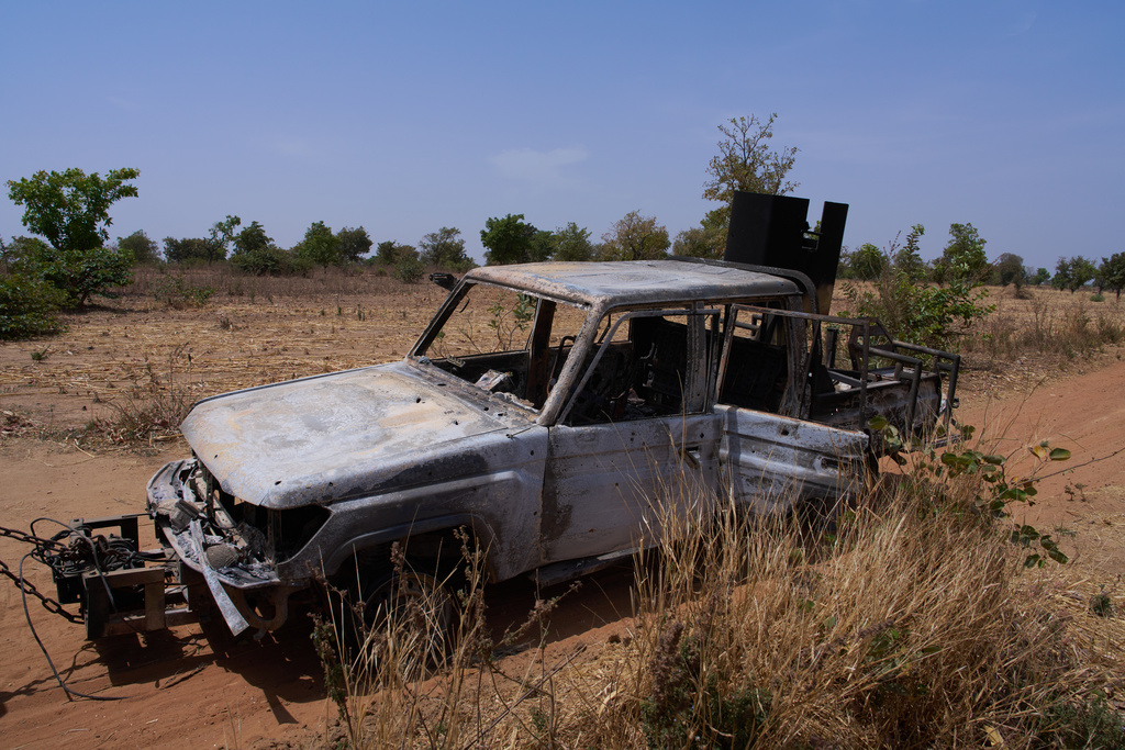 In this photo released by the Kebbi State government, a burned military truck is seen at the scene of a late Tuesday ambush by armed militants in Shanga, Kebbi, northern Nigeria, Wednesday, March 25, 2026. (Kebbi State Government via AP)