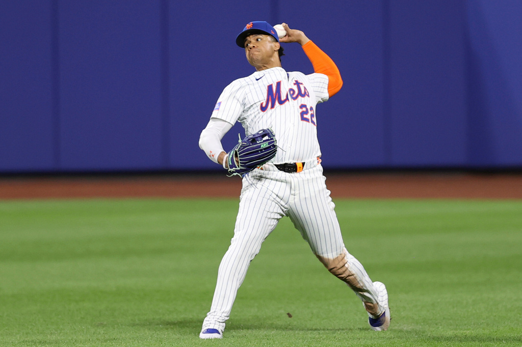 FILE - New York Mets outfielder Juan Soto throws the ball during the eighth inning of a baseball game against the Philadelphia Phillies, Aug. 27, 2025, in New York. (AP Photo/Pamela Smith, File)