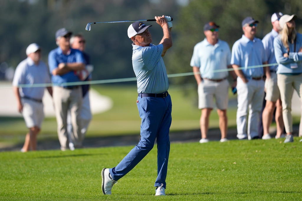 Davis Love III hits from the first fairway during the first round of the RSM Classic golf tournament, Thursday, Nov. 20, 2025, in St. Simons Island, Ga. (AP Photo/Mike Stewart)