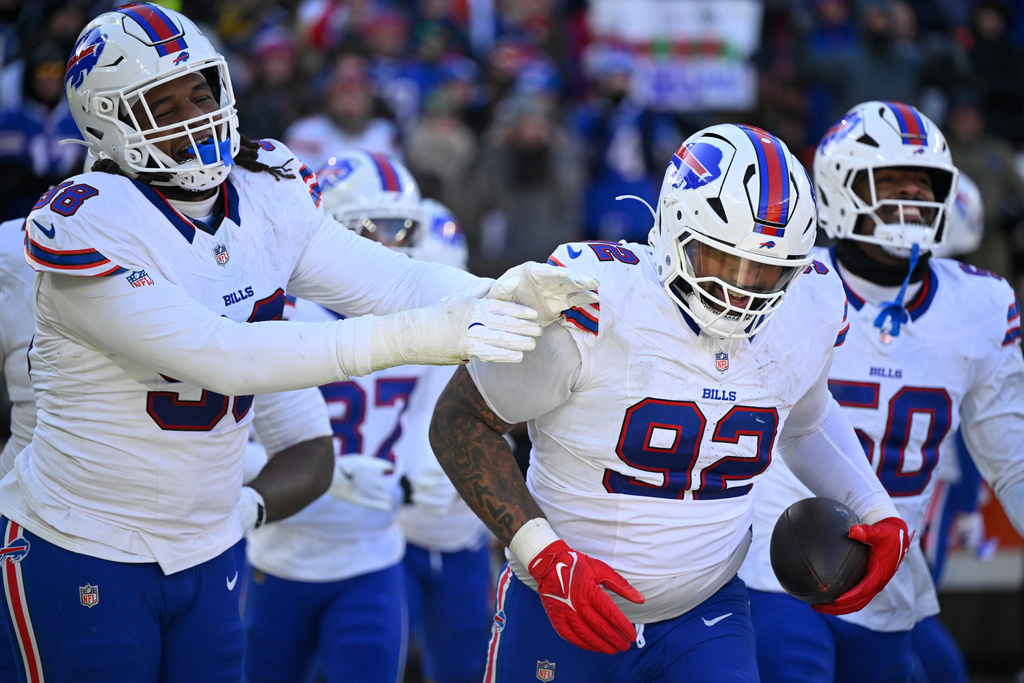 Buffalo Bills defensive tackle Daquan Jones (92) celebrates an interception against the Cleveland Browns during the second half of an NFL football game in Cleveland, Sunday, Dec. 21, 2025. (AP Photo/David Richard)