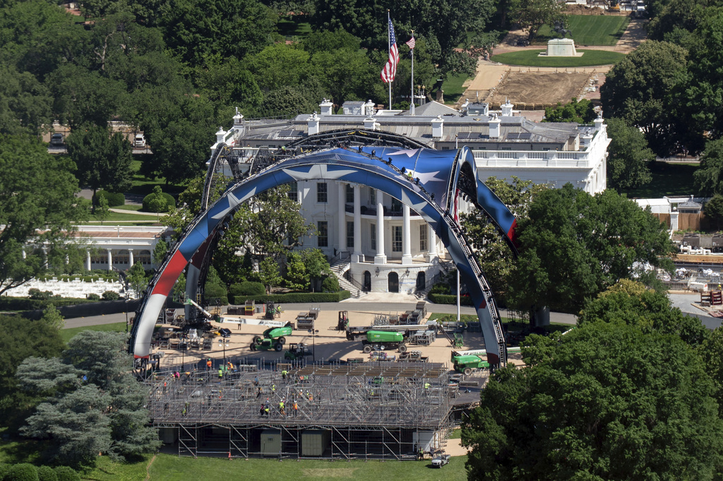 Workers continue building the cage for a future UFC fight on the South Lawn in front of the White House, Saturday, May 30 2026, in Washington, as seen from the Washington Monument. (AP Photo/Jose Luis Magana)