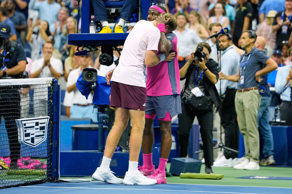 Frances Tiafoe, of the United States, right, and Alex Michelsen, of the United States, embrace after Tiafoe won their match during the quarterfinal round of the U.S. Open tennis championships, Tuesday, Sept. 8, 2026, in New York. (AP Photo/Seth Wenig)