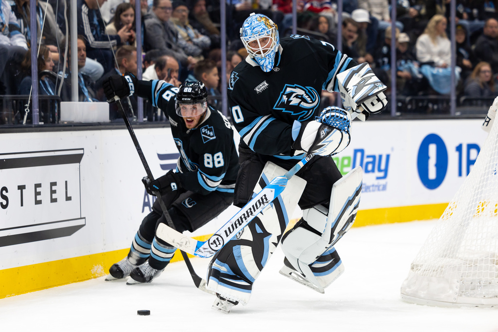 Utah Mammoth goaltender Karel Vejmelka passes the puck during the third period of an NHL hockey game against the Montréal Canadiens, Wednesday, Nov. 26, 2025, in Salt Lake City. (AP Photo/Anna Fuder)