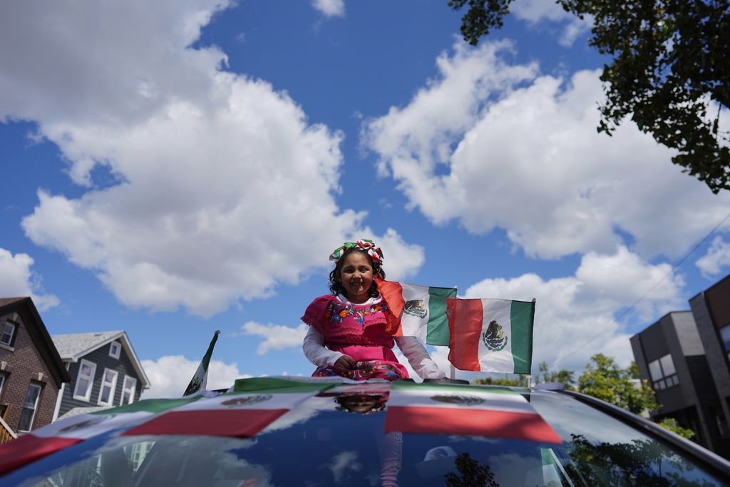 A participant prepares for the 2025 Pilsen Mexican Independence Day parade Saturday, Sept. 6, 2025, in Chicago. (AP Photo/Carolyn Kaster)