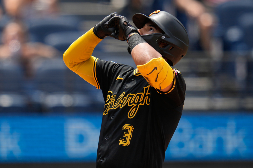 Pittsburgh Pirates' Nick Gonzales (3) gestures as he runs to home plate with a home run in the sixth inning of the first baseball game of a split doubleheader against the Cleveland Guardians in Cleveland, Saturday, June 18, 2026. (AP Photo/Sue Ogrocki)