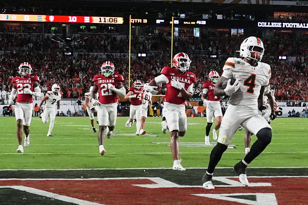 Miami running back Mark Fletcher Jr. scores against Indiana during the second half of the College Football Playoff national championship game, Monday, Jan. 19, 2026, in Miami Gardens, Fla. (AP Photo/Marta Lavandier)