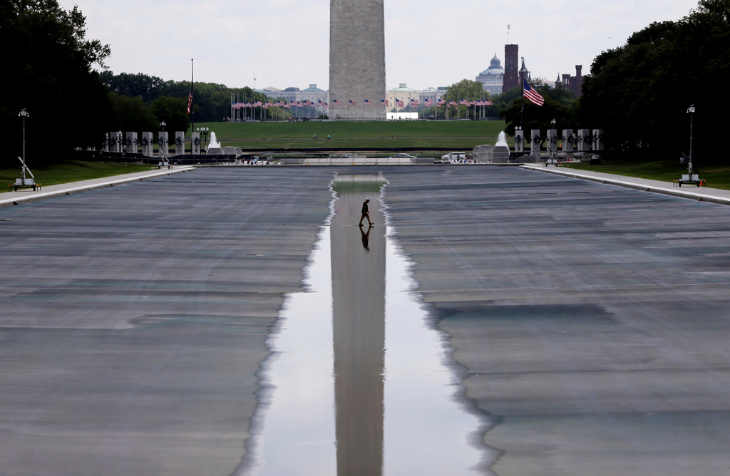 The Washington Monument is seen in the background of the now drained Lincoln Memorial Reflecting Pool, Wednesday, July 29, 2026, in Washington. (AP Photo/Rahmat Gul)