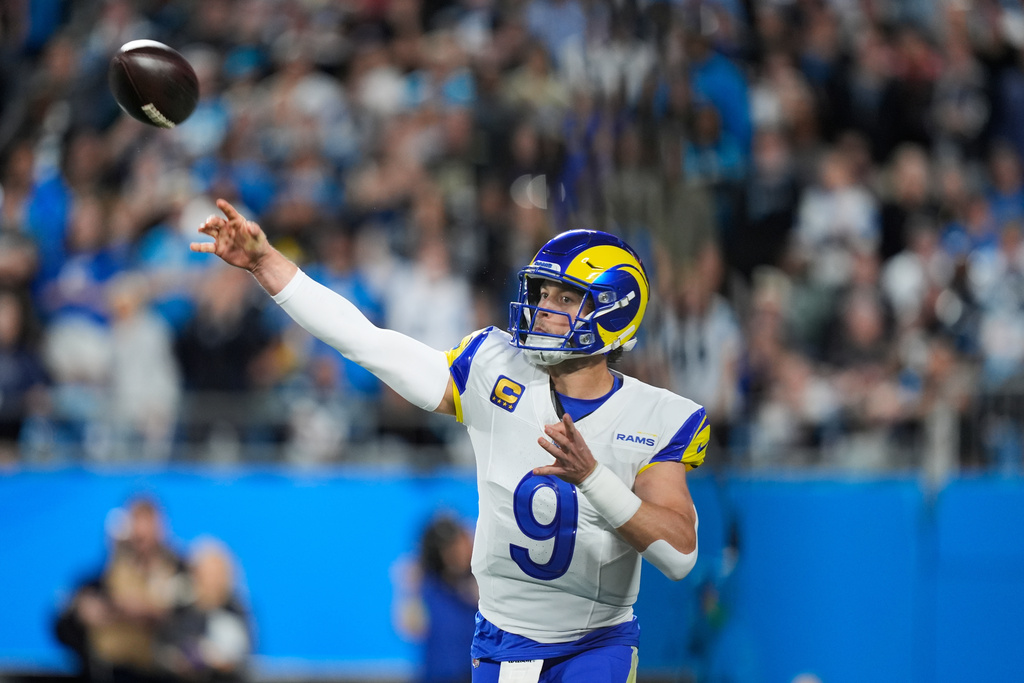 Los Angeles Rams quarterback Matthew Stafford (9) throws a pass during the first half of an NFL wild-card playoff football game against the Carolina Panthers, Saturday, Jan. 10, 2026, in Charlotte, N.C. (AP Photo/Erik Verduzco)
