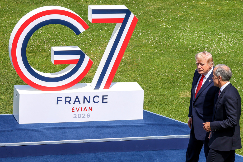 U.S. President Donald Trump, left, speaks with Canadian Prime Minister Mark Carney prior to a group photo of G7 leaders and invited nations during the G7 summit in Evian-les-Bains, France, Tuesday, June 16, 2026. (Dominique Jacovides, Pool Photo via AP)