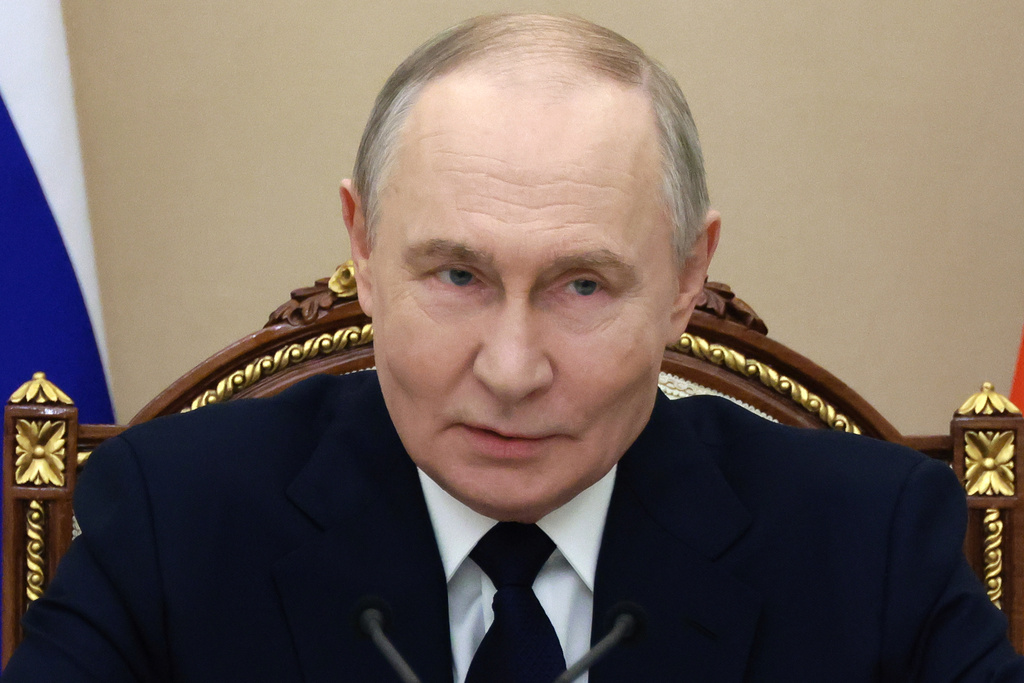 Russian President Vladimir Putin attends a meeting with senior military officers at the Kremlin in Moscow, Russia, Monday, Dec. 29, 2025. (Mikhail Metzel/Sputnik, Kremlin Pool Photo via AP)