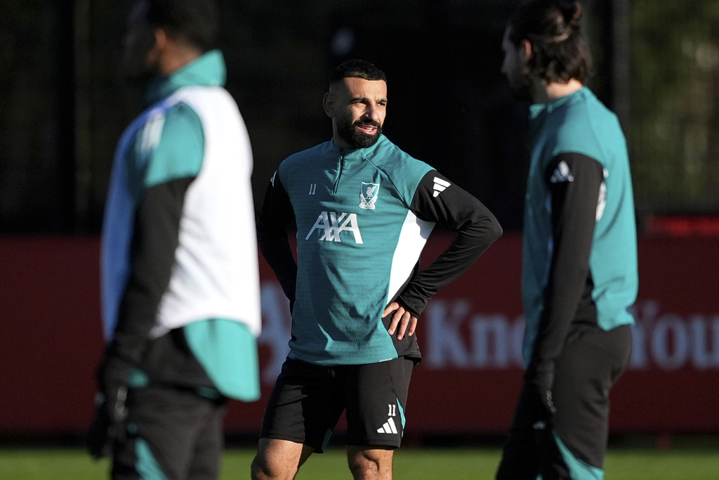 Liverpool's Mohamed Salah, center, attends a team training session at the AXA Training Centre, Liverpool, England, Tuesday, Nov. 25, 2025, ahead of Wednesday's Champions League match against PSV Eindhoven. (Peter Byrne/PA via AP)