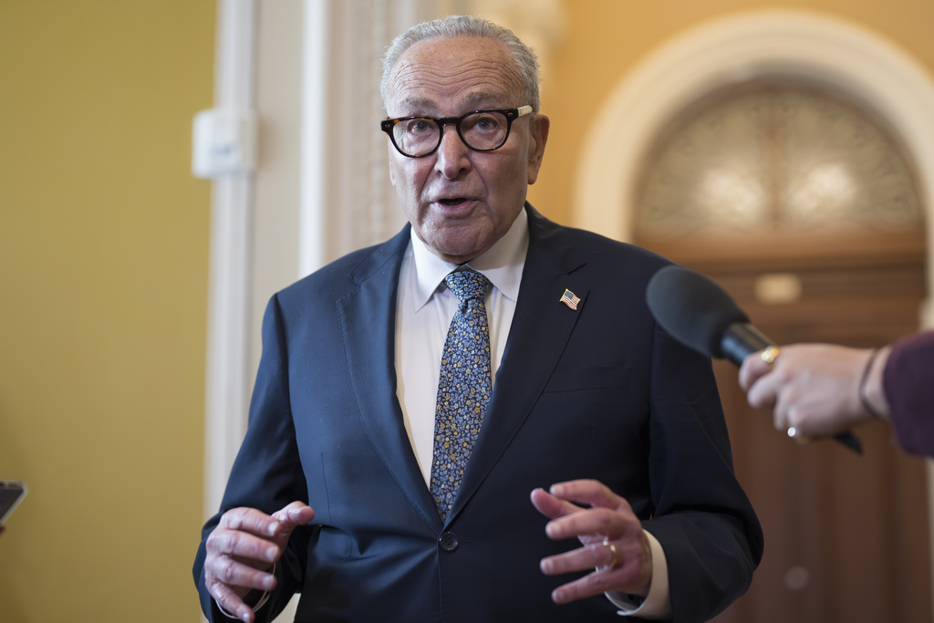 Senate Minority Leader Chuck Schumer, D-N.Y., holds an impromptu news conference with reporters just outside the chamber to say he has filed an amendment on the Senate floor to require the attorney general to release the Jeffrey Epstein files and Republicans will have to vote on it, at the Capitol in Washington, Wednesday, Sept. 10, 2025. (AP Photo/J. Scott Applewhite)