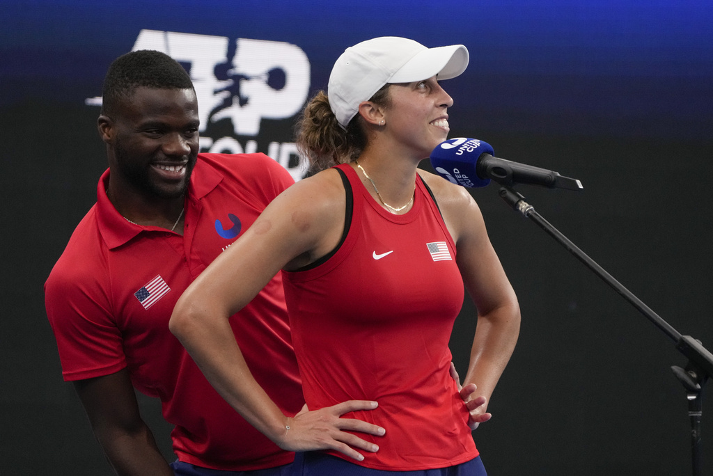 FILE - United States' Frances Tiafoe, left, jokes with teammate Madison Keys during an interview on court following Keys' win over Marie Bouzkova of the Czech Republic in their Group C match at the United Cup tennis event in Sydney, Australia, Thursday, Dec. 29, 2022. (AP Photo/Mark Baker, File)
