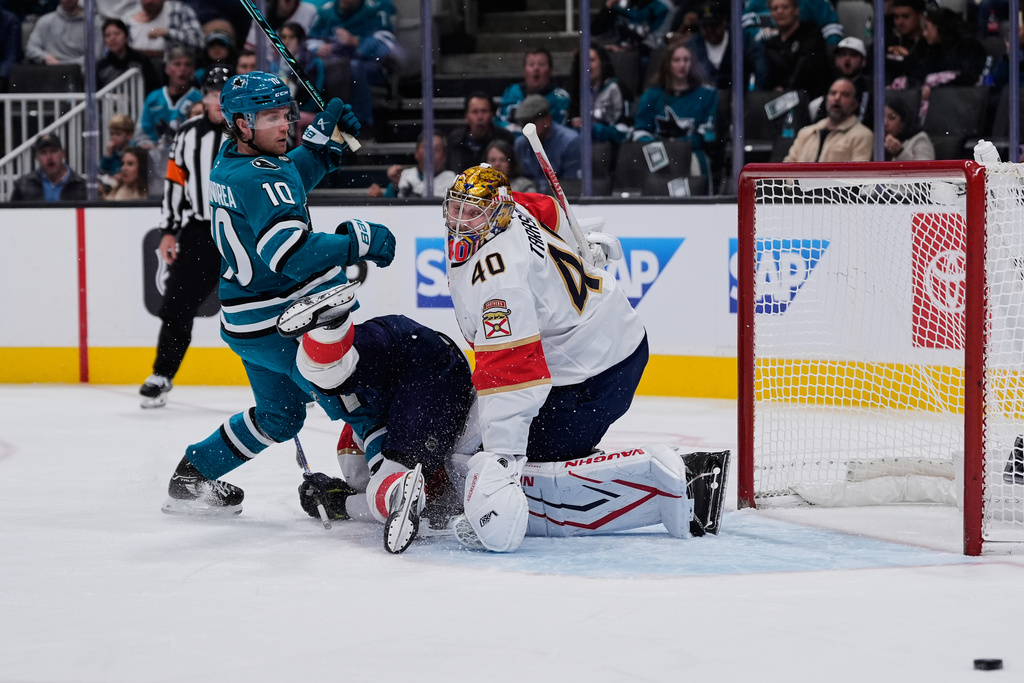 Florida Panthers goaltender Daniil Tarasov (40) looks at the puck after deflecting a shot during the first period of an NHL hockey game against the San Jose Sharks, Saturday, Nov. 8, 2025, in San Jose, Calif. (AP Photo/Godofredo A. Vásquez)