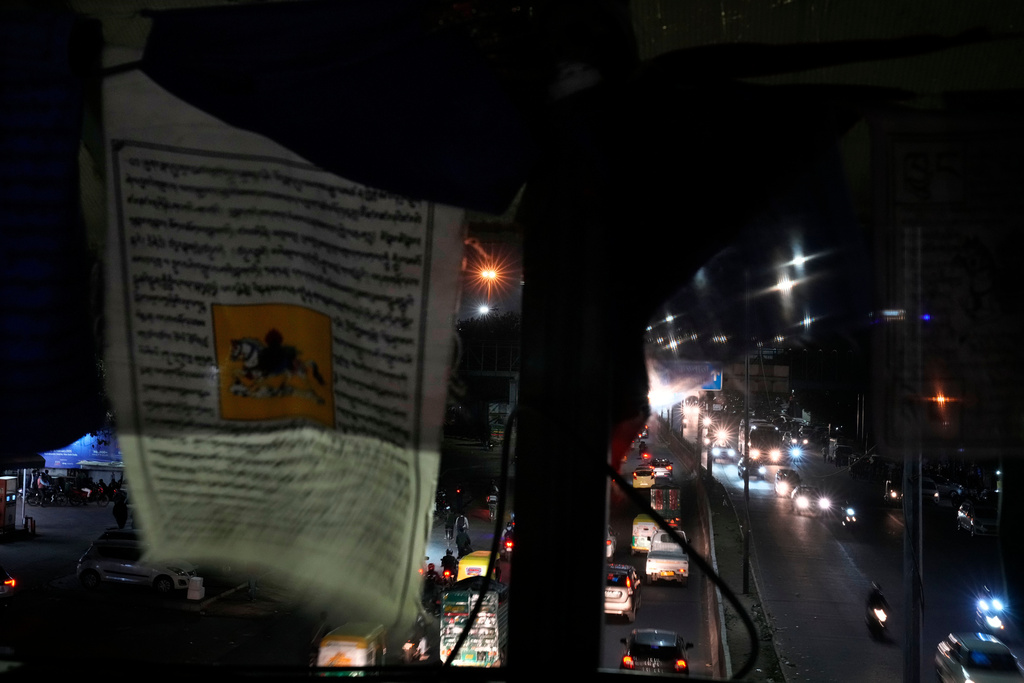 Tibetan prayers hang from a footbridge at Majanu ka Tila, an exile Tibetan settlement, in New Delhi, India, March 5, 2025. (AP Photo/Manish Swarup)