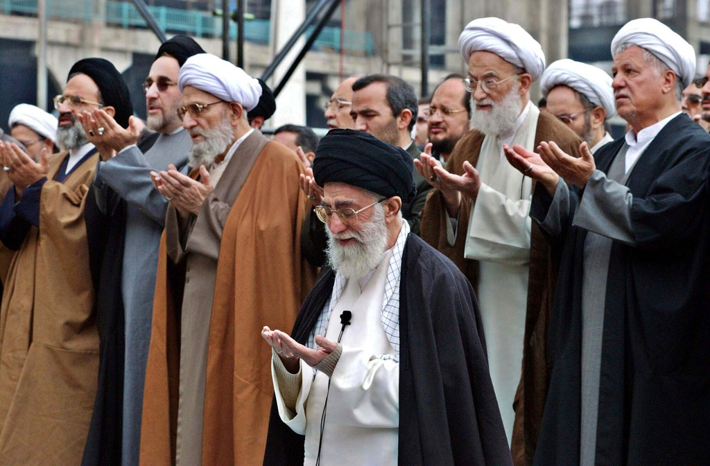 FILE - Iranian Supreme Leader Ayatollah Ali Khamenei, foreground, leads an Eid al-Fitr prayer, marking the end of Muslims' holy fasting month of Ramadan, in Tehran, Iran, Nov. 14, 2004. (AP Photo/Vahid Salemi, File)