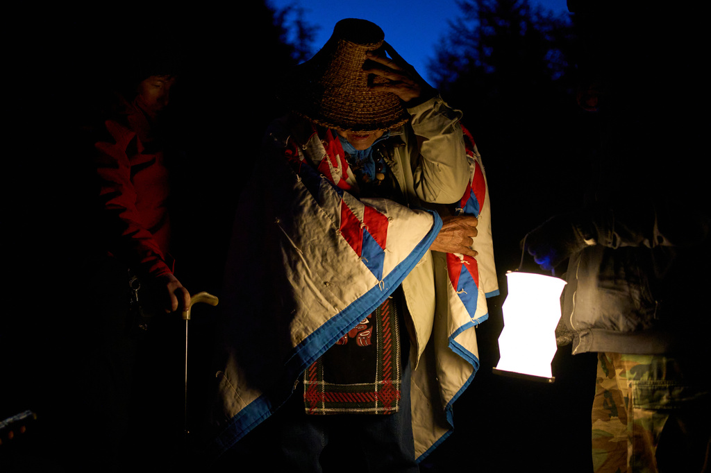 Bill Jones, a First Nations Pacheedaht elder, prepares to join a blockade on a road used for logging before dawn near Port Renfrew, British Columbia, Thursday, May 28, 2026. (AP Photo/Annika Hammerschlag)