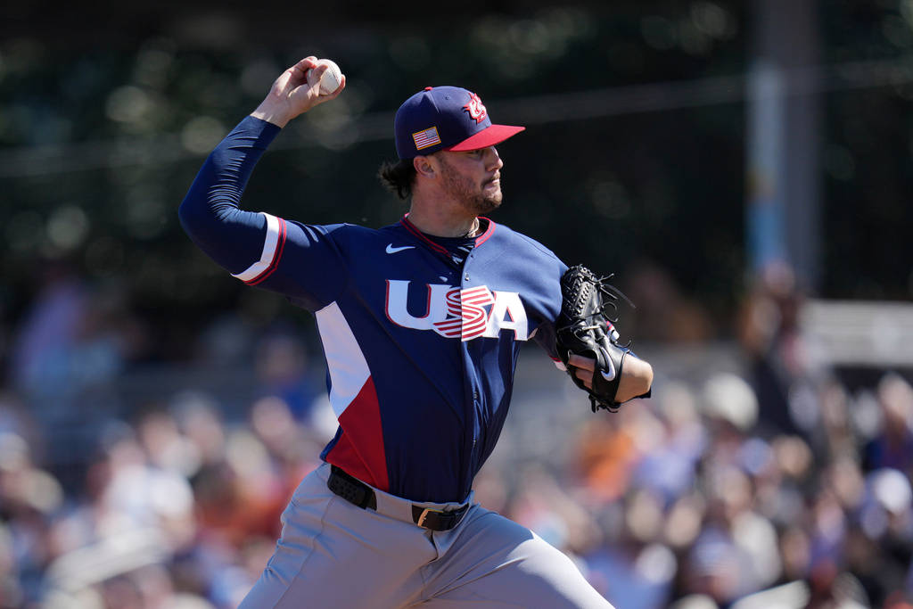 United States starting pitcher Paul Skenes throws against the San Francisco Giants during the first inning of an exhibition baseball game Tuesday, March 3, 2026, in Scottsdale, Ariz. (AP Photo/Ross D. Franklin)